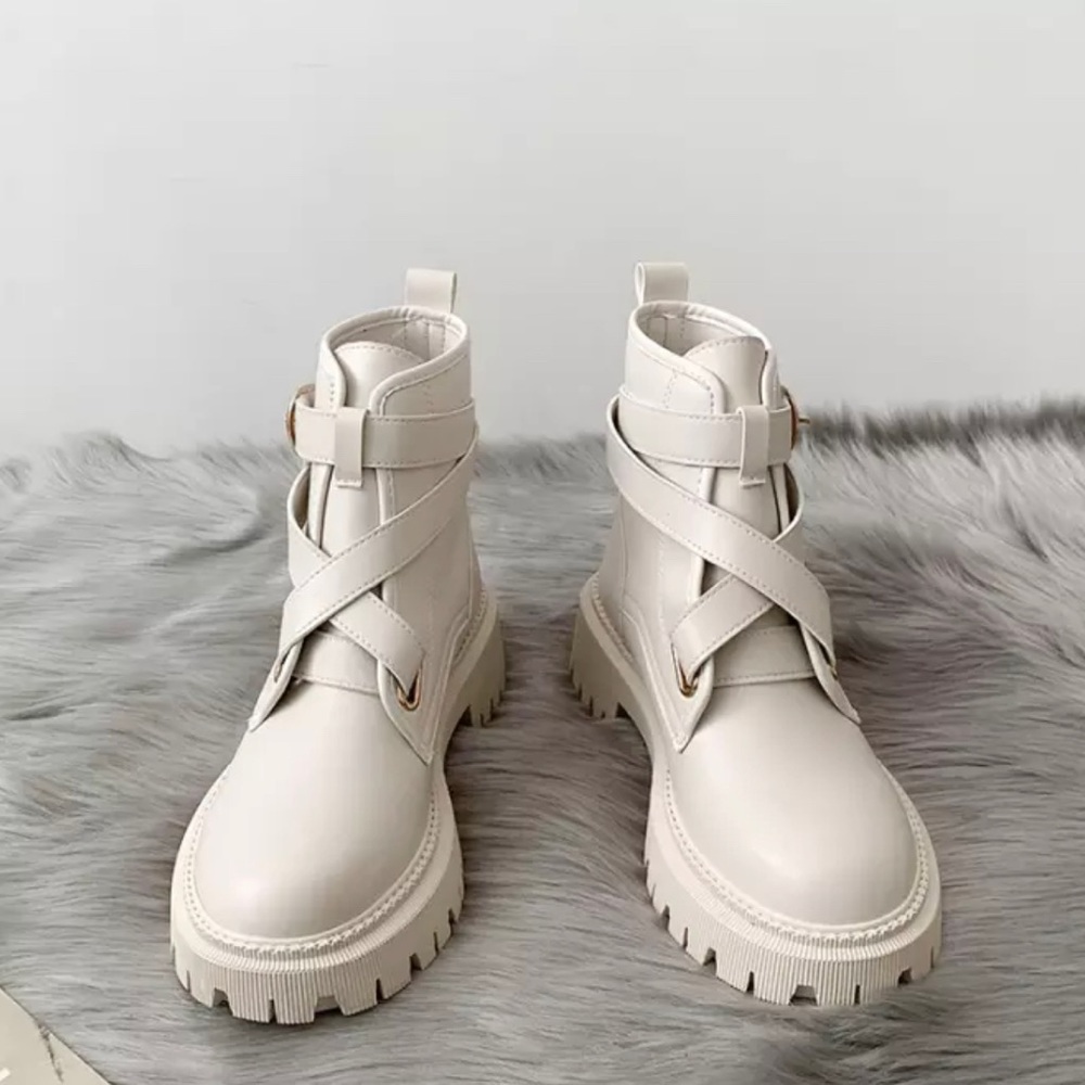 Chunky beige combat boots with cross front strap detail
